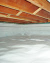 a moisture barrier installed on the walls and floors of a crawl space in Newport