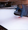 Oak Ridge insulation being installed in a crawl space.