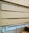 an old-fashioned crawl space door in Athenes about to be replaced