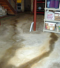 Flooding entering a basement through a floor crack in Corbin