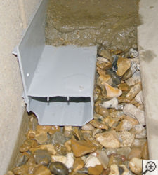 A no-clog basement french drain system installed in Crossville