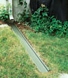 A recessed gutter drain extension installed in Powell, Tennessee and Kentucky