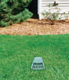 A buried gutter drain downspout extension installed in a Powell home